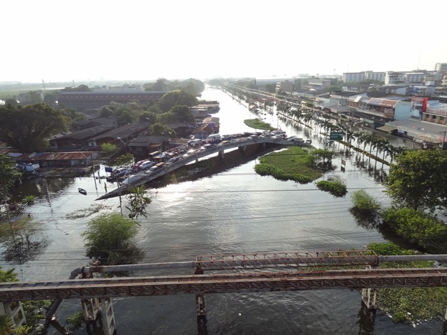 Car owners sought out elevated highways to escape rising floodwaters in and around Bangkok