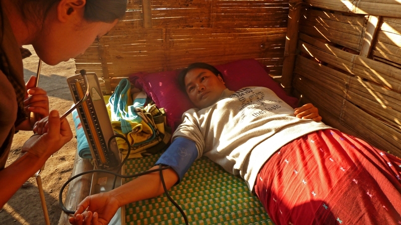 A woman receives treatment at an IDP camp outside of Laiza in Myanmar's northern Kachin State. More than 40,000 people fled their homes following the collapse of a 17-year-old ceasefire between government forces and the Kachin Independence Army