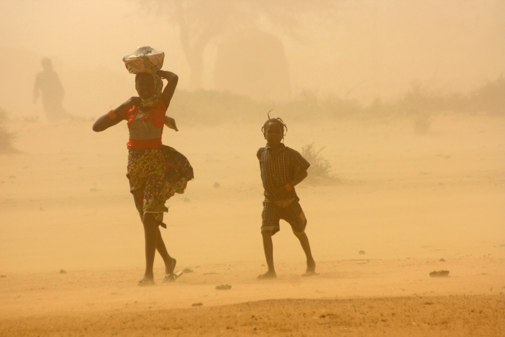 Children walk through a sandstorm in Tillaberi region, Niger (Feb 2012)