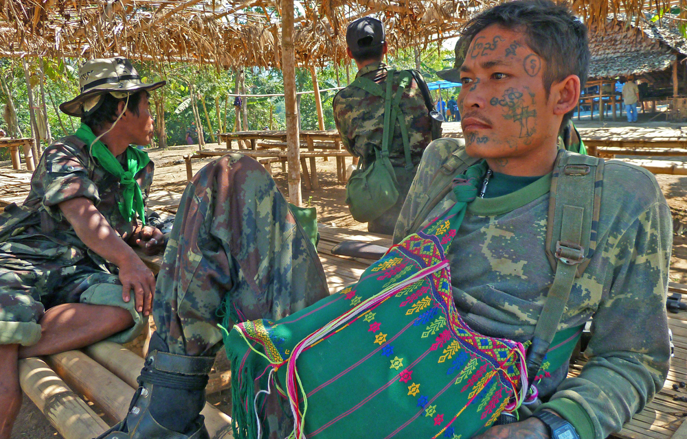 A tatooed Karen soldier in eastern Myanmar. Thousands have been displaced in what has been described as one of the world's longest running conflicts