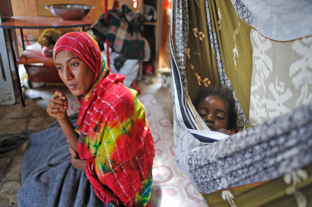 Selioua Muhammad, 25, sits inside her rooftop shelter in an occupied school in Sheik Othman in Aden, Yemen on February 28, 2012. Muhammad fled her home in Abyan in June 2011 and has lived at the school as an IDP since then