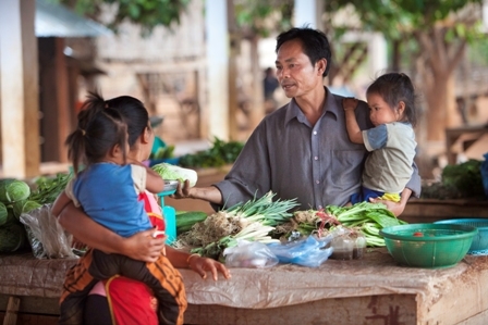 A scene at a local market in Vientiane. GNI per capita in Laos is $1,040, the 2012 LDC graduation threshold was $1,190