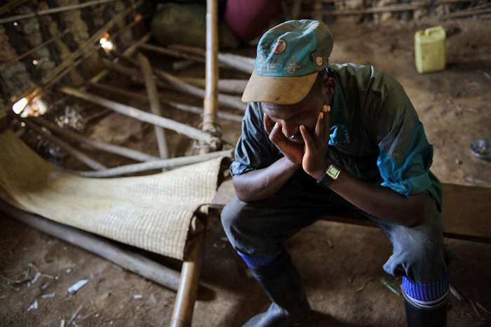 A displaced Congolese man (who wishes to remain anonymous) sits in a classroom of the Katoyi primary school being used by displaced people for shelter in Masisi territory of the Democratic Republic of the Congo's North Kivu province on June 4, 2012