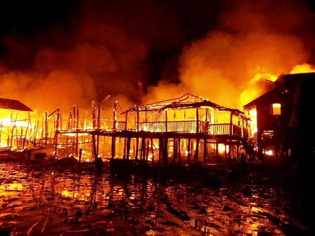 The riverine Rohingya village of Zailya Para in Minbya Township burns after attacks by Buddhist Rakhine mobs in October 2012. More than 100,000 people were displaced in the violence