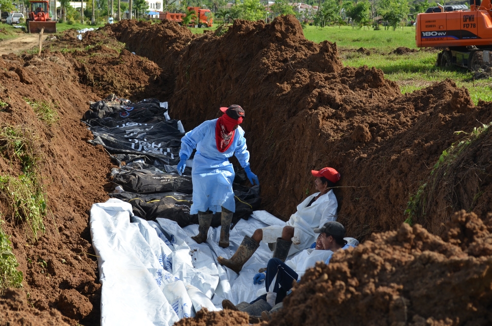 Burial of unclaimed cadavers following the Philippines' Typhoon Haiyan took place some two months after the typhoon hit