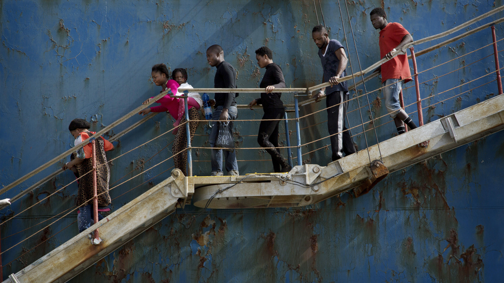 Refugee versus migrant: time for a new label? Migrants disembark at the Sicilian port of Catania after being rescued from a shipwreck by a merchant vessel on 5 May, 2015