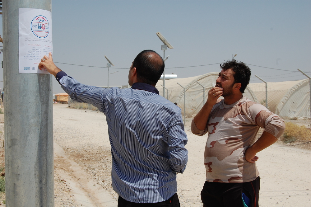 A WFP employee in Iraq explains a new phone center based in Kurdistan
