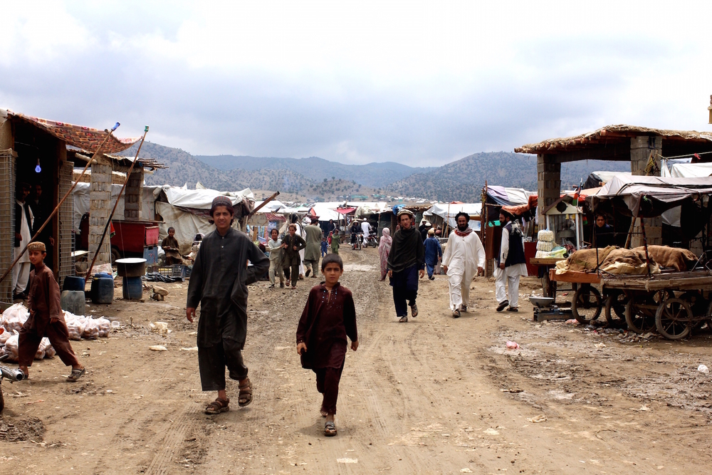 The growing permanence of the Golan refugee camp in Afghanistan's Khost province can be seen in the bazaar that has sprung up in the camp, seen here on 12 May 2015