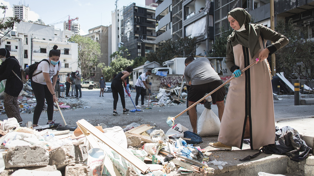 Volunteers clean up the damage in Beirut