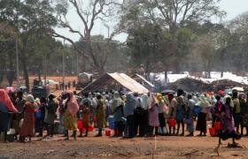 Recent arrivals from the north line up for relief assistance outside a government camp in Vavuniya. Thousands of Tamil civilians have fled the fighting in the north over the past month