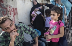 Alla Abdo, left, with his cousin Jihan and her four children, outside Moria reception centre on the Greek island of Lesvos. Abdo said they were Syrians but had lost their documents and been told they could not register at Kara Tepe, a reception centre for