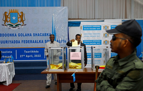 A Somali lawmaker casts a ballot during elections for the speaker of the lower house of parliament, inside the Aden Adde International Airport, Mogadishu, April 2022. 