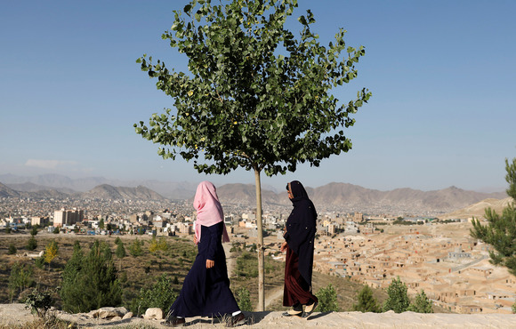 Afghan women walk on top of a hill in Kabul, Afghanistan on 24 June 2021.