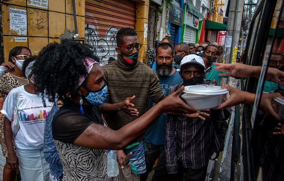 Homeless people awaiting food donations in the historic centre of Salvador, in Brazil’s northeast, a region long affected by drought and social inequality.