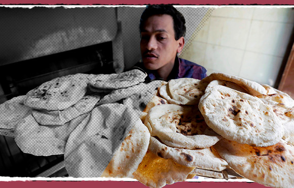 A baker carries bread in El-Kalubia governorate, northeast of Cairo. Egyptians on average consume 146 kilos of wheat products every year, more than double the global average. 