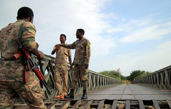 Members of the Amhara special forces stand guard on a bridge near the Ethiopia-Eritrea border on 1 July, 2021. The Tigray conflict has spread into the Amhara and Afar regions in recent weeks. 