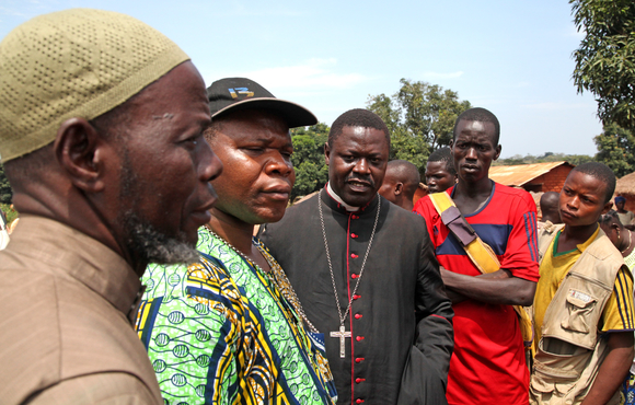 CAR’s top Imam Oumar-Kobine Layama (L), Archbishop Dieudonne Nzapalainga (M) and Bishop of Bossangoa Nestor Aziagba (R) listen to tales of woe from communities on the road from Bossangoa to
the capital Bangui.