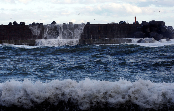A high wave hits a seawall in Tanohata village, Iwate Prefecture, Japan one of the areas hit hardest by the 2011 earthquake and tsunami.