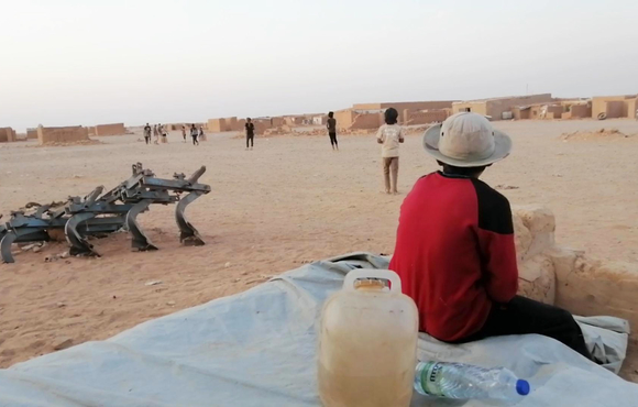 Children play football in Rukban