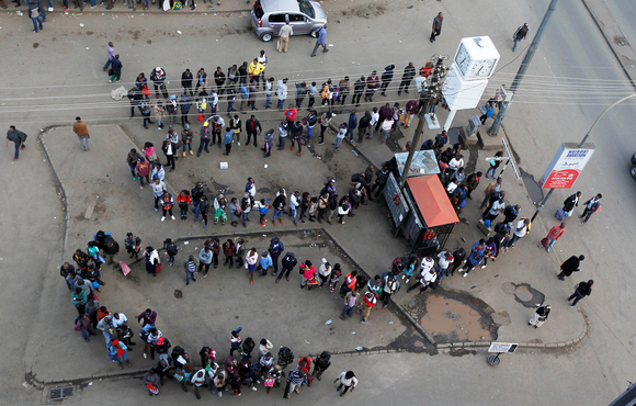 People queuing for public transport in downtown Nairobi