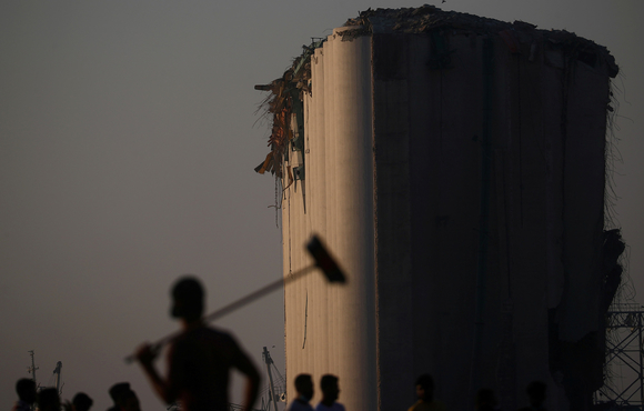 People view the damage at the blast site in Beirut's port area
