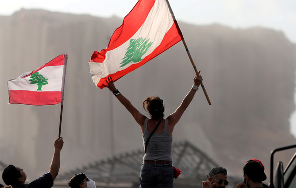 Demonstrators wave Lebanese flags