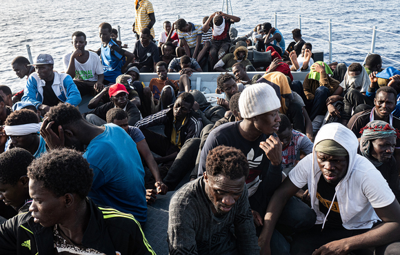 Migrants on board a Libyan Coast Guard boat headed for Tripoli