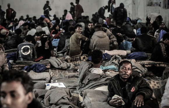 Migrants arbitrarily detained at Tarik al-Sika detention centre in Tripoli – one of around 20 facilities where detainees in Libya are trapped in a cycle of extortion, torture, and trafficking – on 16 December 2020.