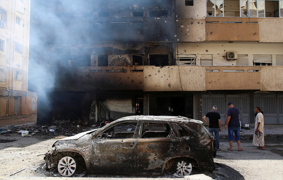 Tripoli residents on Sunday, 28 August examined damage caused by  fierce clashes a day earlier in the Libyan capital, Tripoli.