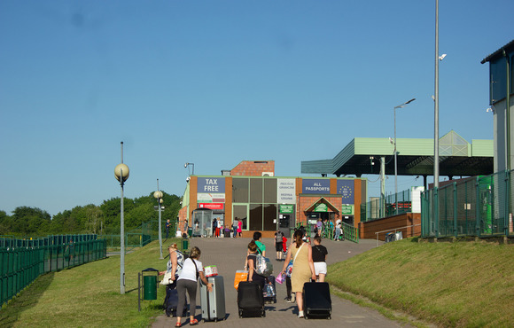 Ukrainians with their luggage walking toward the Medyka border crossing to re-enter Ukraine from Poland on 25 June.