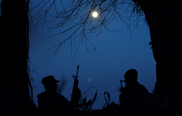 Guerrilla fighters opposed to the military coup are seen in Kawkareik in southeast Myanmar’s Karen State on 19 December 2021. Clashes continue to intensify in the township and other areas in 2022.