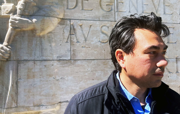 Mayima stands in front of a memorial in Geneva