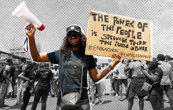 A demonstrator holds a banner during a protest against alleged police brutality in Lagos. October 2020.