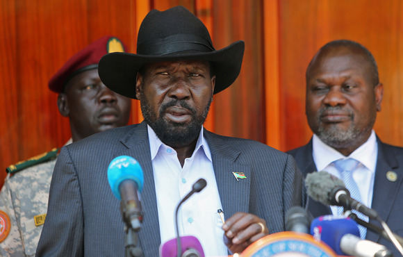 South Sudan's President Salva Kiir Mayardit speaks into a microphone behind a podium.