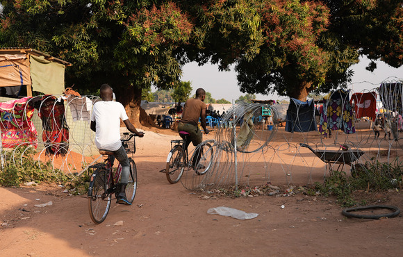 Displaced people take refuge in a camp adjacent to a UN base in Tambura in southwestern South Sudan. 80,000 people have been uprooted in the town since last year.
