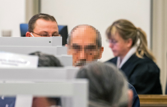 Former Syrian intelligence officer Anwar Raslan, convicted of war crimes for running a detention centre where thousands were tortured, arrives at court in Koblenz, Germany on 4 June 2020. 