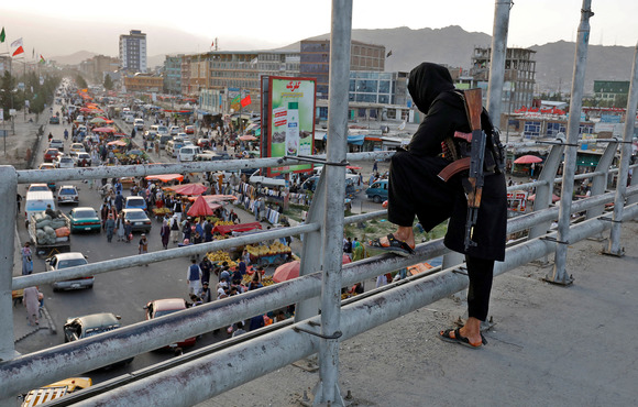 A member of the Taliban on a bridge in Kabul, on 6 August 2022. 
