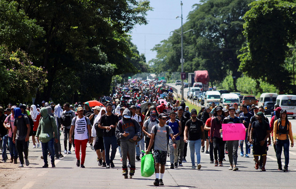 Venezuelans leave Tapachula in southern Mexico as part of a migrant caravan heading north to the US border after growing tired of waiting weeks for the humanitarian visa to cross the country, on 24 June 2022.