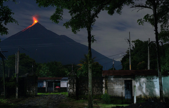 A view of the Fuego volcano erupting from the entrance to the 15 de Octubre La Trinidad community in Guatemala on 27 August, 2020