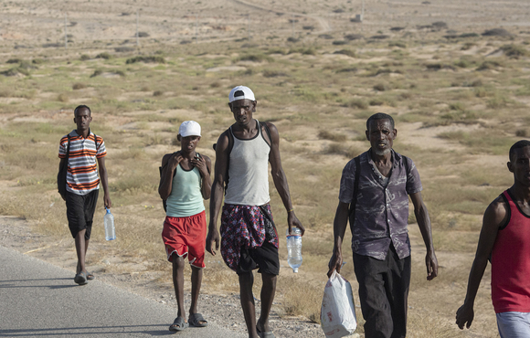 After arriving in Yemen by boat, African migrants take the road inland from the coast to Ataq, in Yemen's southern Shabwa province, 13 November 2020