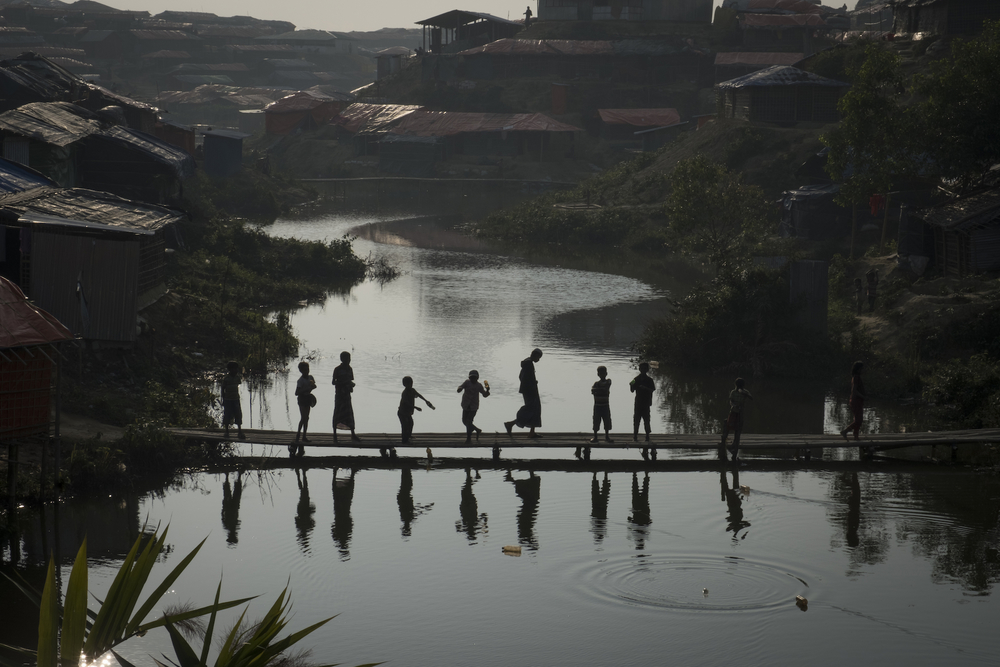 A group of Rohingya children gather on a bamboo bridge in Kutupalong makeshift settlement in Bangladesh’s Cox's Bazar District on 11 January 2018