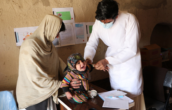 A baby girl is screened for malnutrition in a remote health facility in the southern district of Spin Boldak, close to the border with Pakistan.