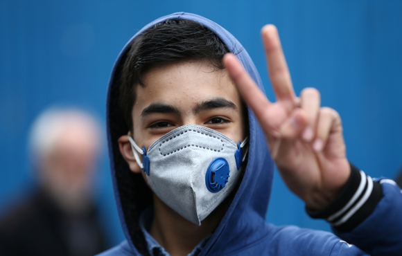 An Iranian boy wears a protective mask to ward off coronavirus in Tehran, Iran February 20, 2020.