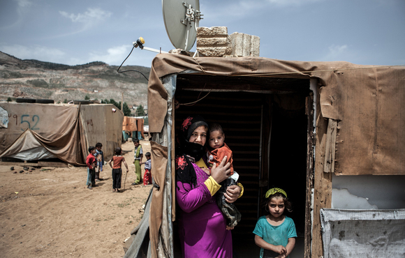 An unregistered Syrian refugee family, originally from Aleppo, in an informal settlement in Lebanon's eastern Bekaa Valley